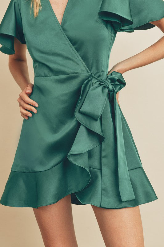 green emerald velvet dress Emerald Green Flutter Sleeve Mini Wrap Dress – Aquarius Brand