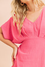 Fuchsia A V-Neck Dolman Short Sleeve Woven Blouse With Front Pleat Details