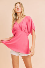 Fuchsia A V-Neck Dolman Short Sleeve Woven Blouse With Front Pleat Details