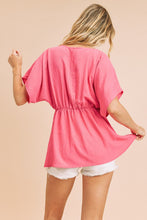 Fuchsia A V-Neck Dolman Short Sleeve Woven Blouse With Front Pleat Details