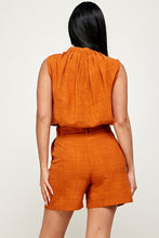 Orange Sleeveless Top And Shorts