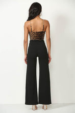 Black Solid, Full Length Pants In A Flare Style With A High Waist, And Wide Legs